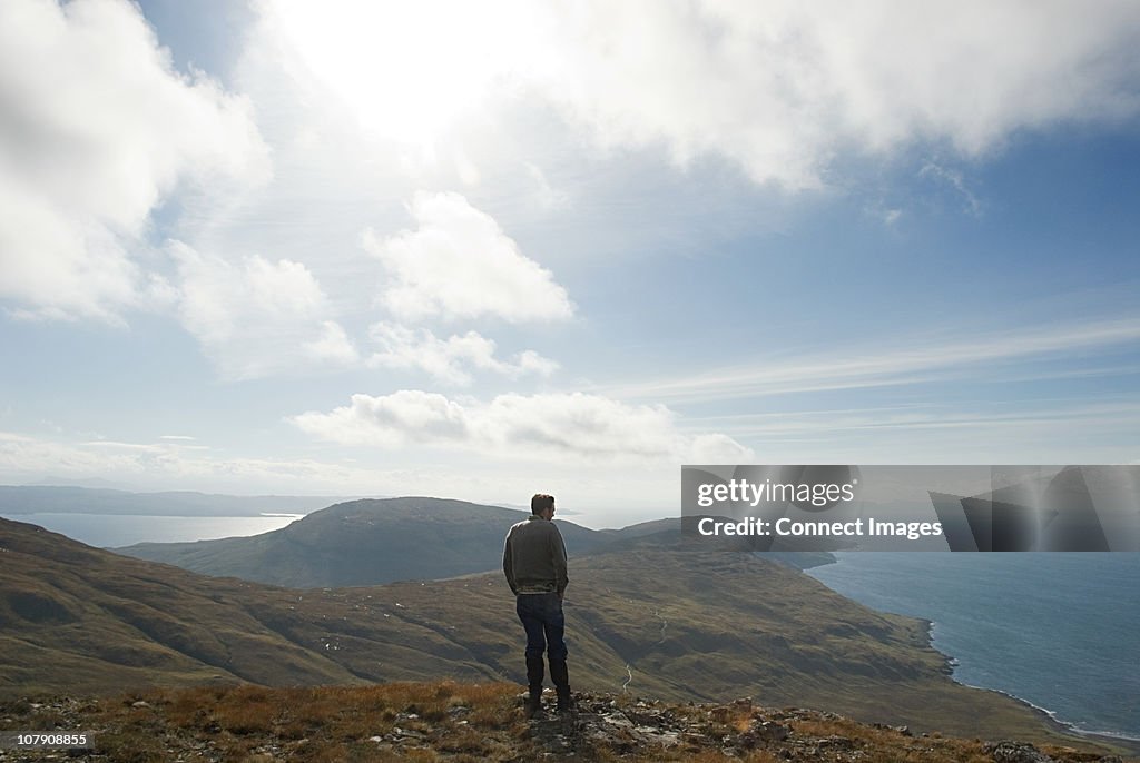 Man looking at view of landscape