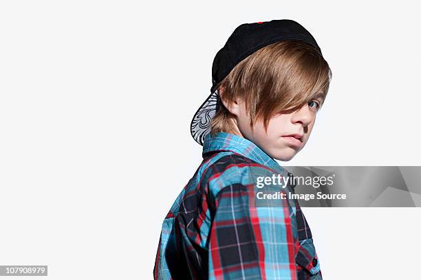 teenage boy looking over shoulder - boy looking over shoulder stock pictures, royalty-free photos & images