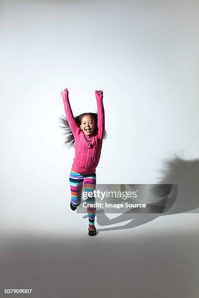girl jumping - girls in leggings stock-fotos und bilder