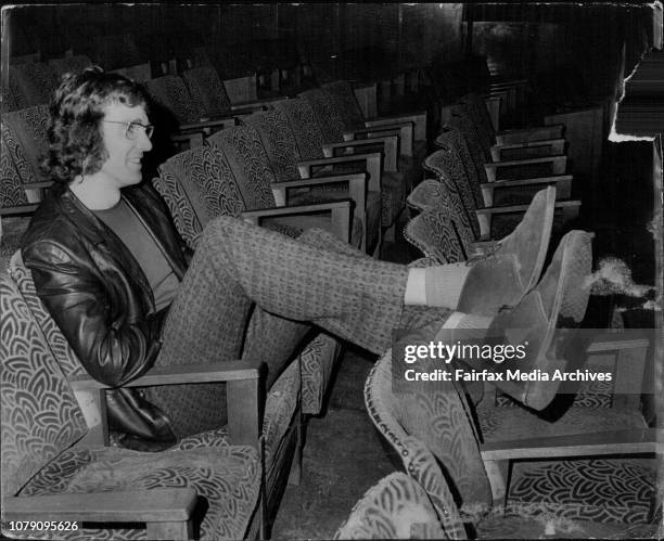 Mr. David Williamson, Australian Playwright sits in the Playbox theatre watching a rehearsal of his play "The Removalists." August 9, 1972. .