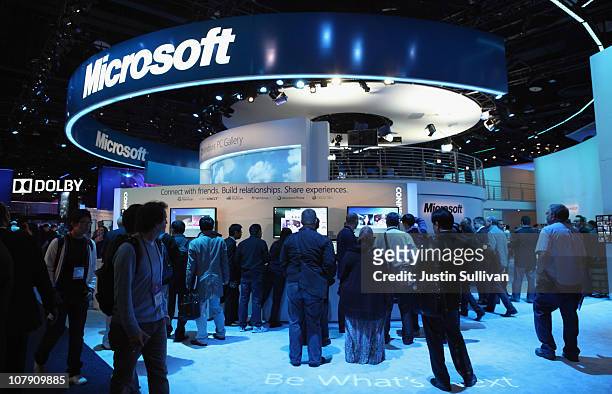 Attendees crowd into the Microsoft booth during the 2011 International Consumer Electronics Show at the Las Vegas Convention Center January 6, 2011...