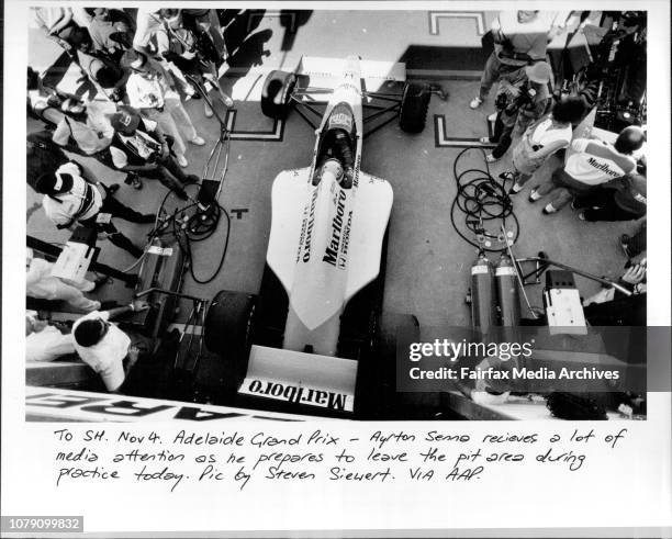 Adelaide Grand Prix -- Ayrton Senna receives a lot of media attention as he prepares to leave the pit area during practice today. August 21, 1990. .