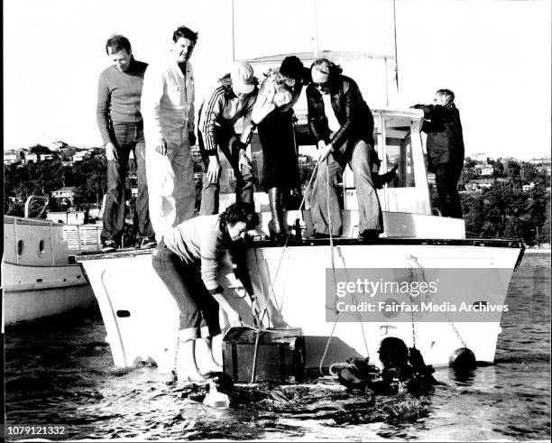 Driver Bruce Higgs who found the treasure chest, police diver Senior Const. Graeme Jamieson, 2Sm disc jockey George Mooe and a much relieved Susie De...