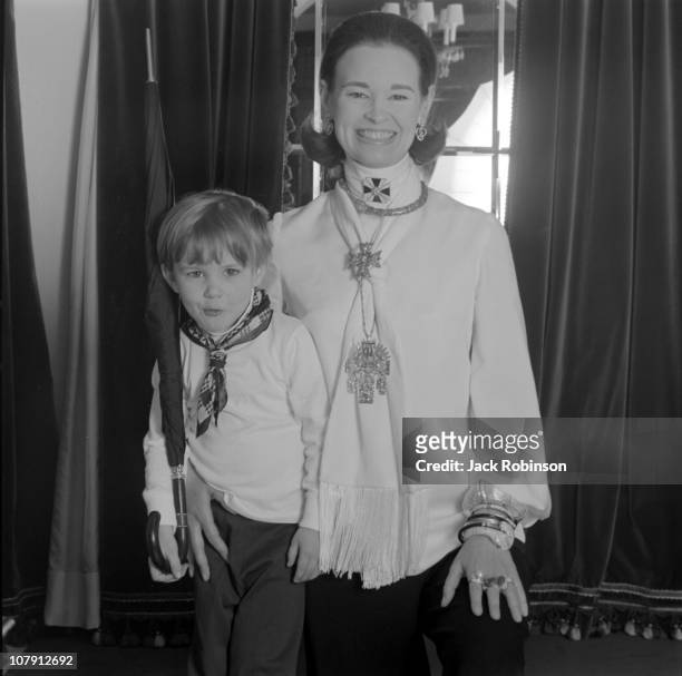 Socialite and heiress Gloria Vanderbilt poses for a portrait session with her son Carter Vanderbilt Cooper in their home in circa 1969 in...