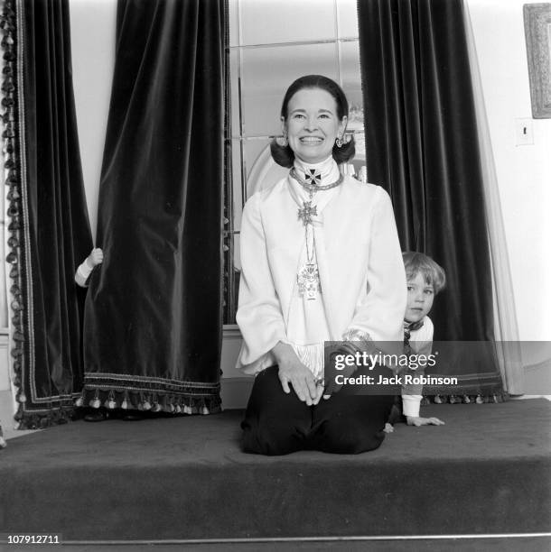 Socialite and heiress Gloria Vanderbilt poses for a portrait session with her son Carter Vanderbilt Cooper in their home in circa 1969 in...