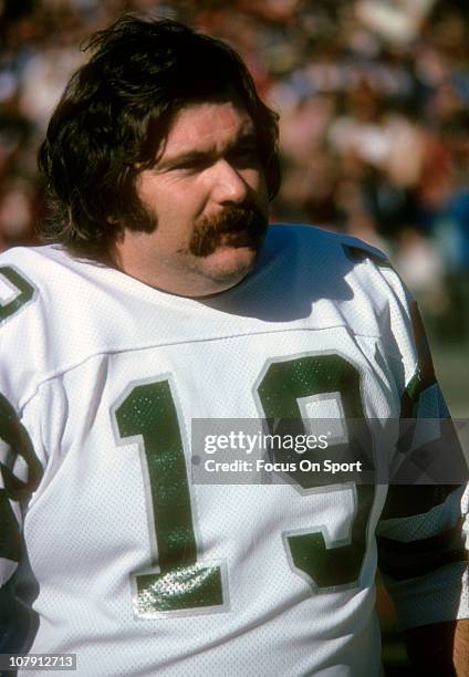 Kicker Tom Dempsey of the Philadelphia Eagles looks on from the sidelines during an NFL football game circa 1974. Dempsey played for the Eagles from...