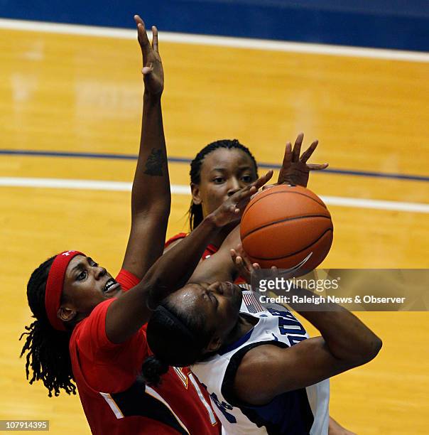 Duke guard/forward Karima Christmas is fouled in the second half by Maryland center Lynetta Kizer at Cameron Indoor Stadium in Durham, North...
