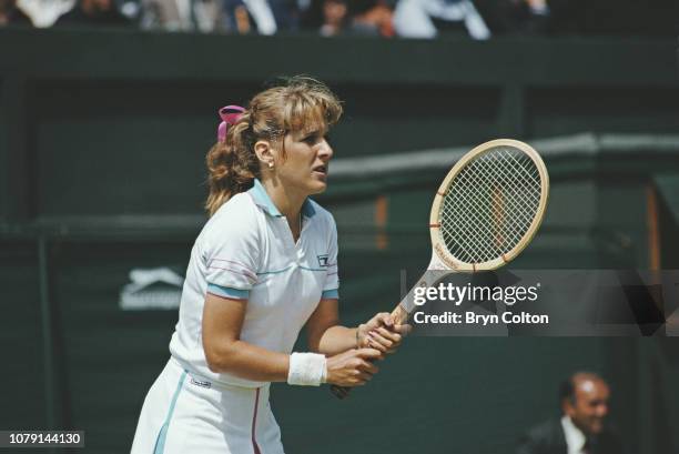 American tennis player Tracy Austin, plays in a singles match during the 1979 Wimbledon Tennis Championships at the club in Wimbledon, U.K., on...