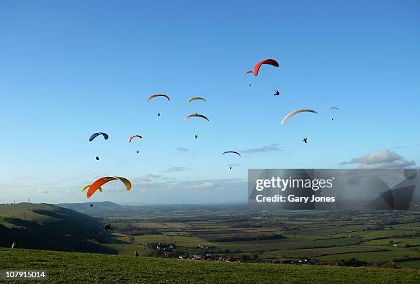 birdmen cometh - paragliding stock pictures, royalty-free photos & images