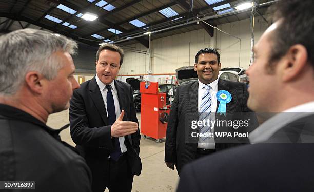 Prime Minister David Cameron visits the Adamsons Vehicle Care Centre as he campaigns with local Conservative candidate Kashif Ali on January 6, 2011...