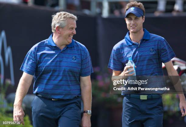 Colin Montgomerie of Scotland walks with Rhys Davies of Wales at 1st hole during day one of The Royal Trophy tournament at Black Mountain Golf Club...