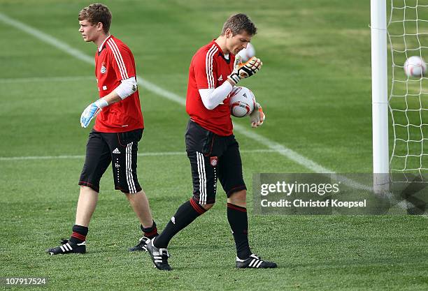 Hans-Joerg Butt of Bayern and Thomas Kraft of Bayern attend the FC Bayern Muenchen training session at Aspire Academy for Sports Excellence training...