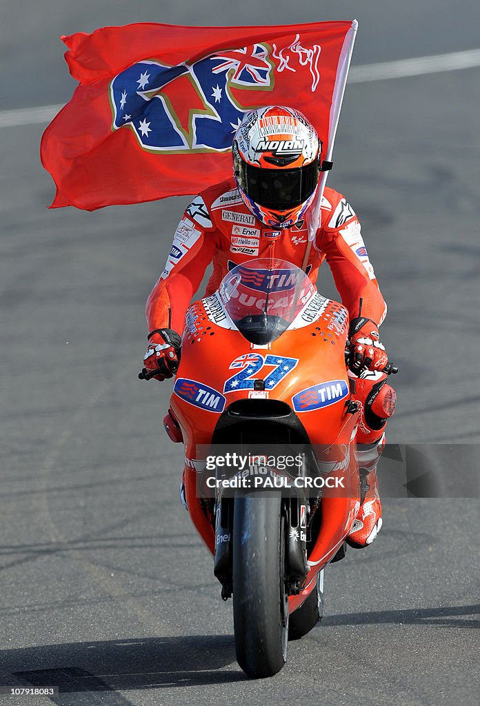 Casey Stoner of Australia celebrates win