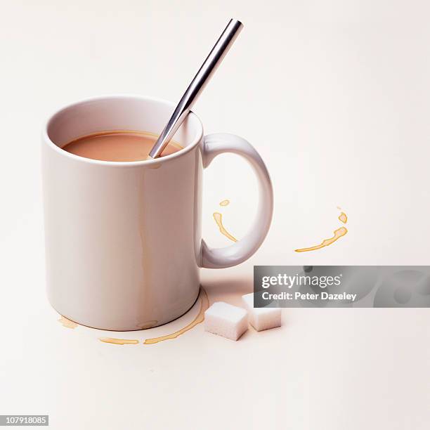 cup of tea with sugar lumps on white background - kaffeepause stock-fotos und bilder