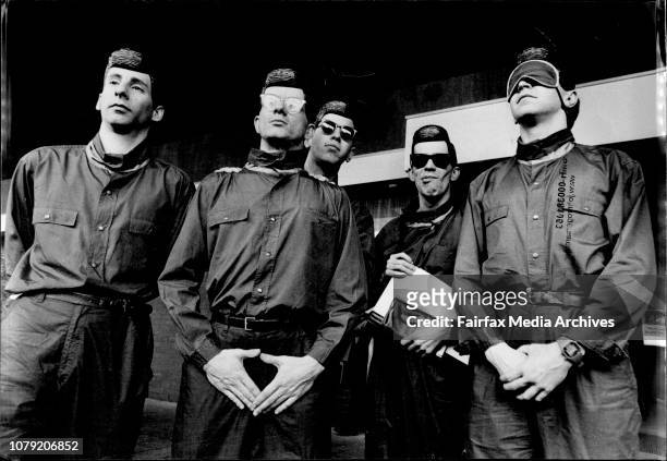 Devo arrived in Sydney today looking like they had stepped out of a shop store window rather than Jumbo.They posed for fans and press before boarding...