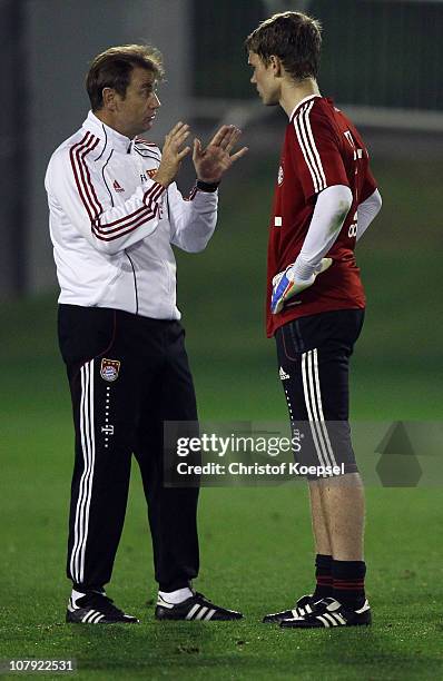 Goalkeeper coach Frans Hoek talks to Thomas Kraft of Bayern during the FC Bayern Muenchen training session at Aspire Academy for Sports Excellence...