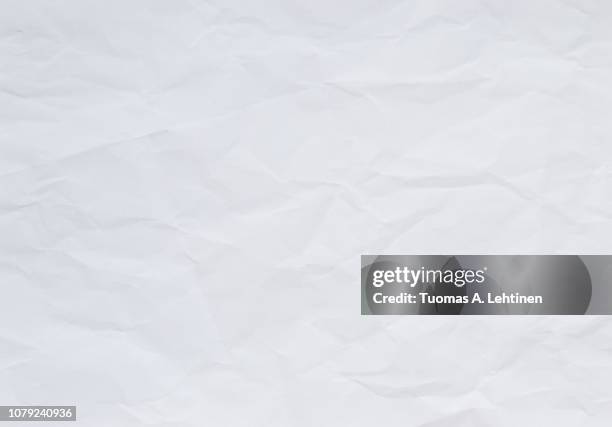 high quality crumpled white and blank paper sheet texture background. - wrinkled paper stockfoto's en -beelden