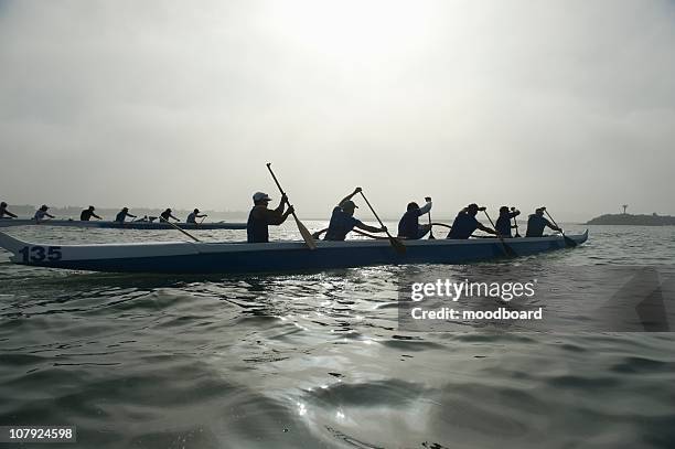 outrigger canoeing team compete - outrigger stock pictures, royalty-free photos & images