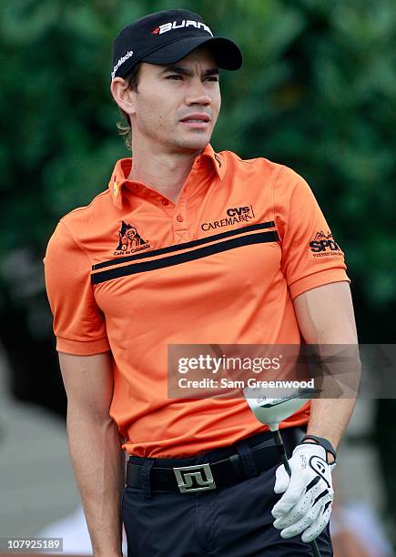 Camilo Villegas of Columbia hits a shot on the 1st hole during the first round of the Hyundai Tournament of Champions at the Plantation course on...