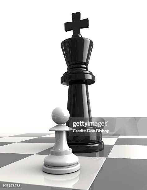 pawn confronting king on chess board - chess board stock illustrations
