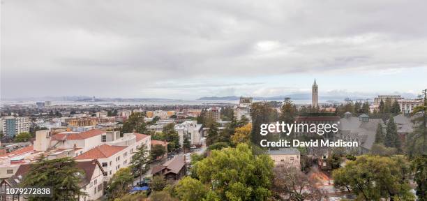 Panoramic view of the University of California at Berkeley campus including Sather Tower, also known as The Campanile, the city of Berkeley, and in...
