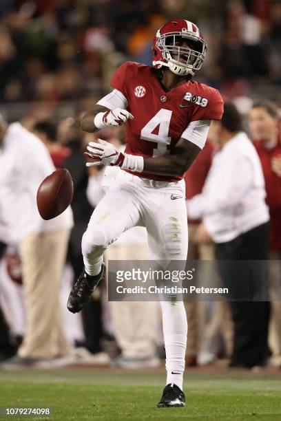 Jerry Jeudy of the Alabama Crimson Tide reacts after making a first down reception against the Clemson Tigers in the CFP National Championship...