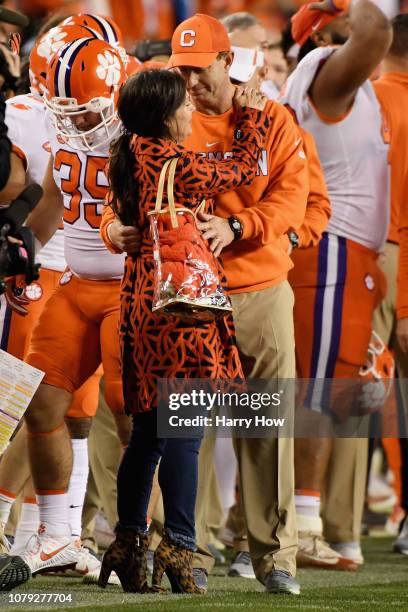 Head coach Dabo Swinney of the Clemson Tigers celebrates with his wife Kathleen Bassett after his teams 44-16 win over the Alabama Crimson Tide in...