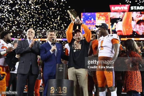 Head coach Dabo Swinney of the Clemson Tigers celebrates his teams 44-16 win over the Alabama Crimson Tide with the trophy in the CFP National...