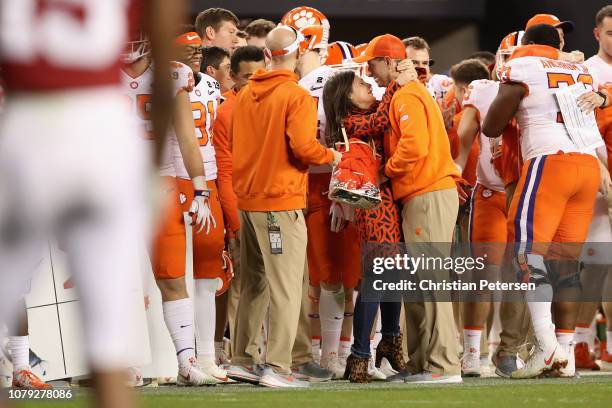 Head coach Dabo Swinney of the Clemson Tigers celebrates with his wife Kathleen Bassett after his teams 44-16 win over the Alabama Crimson Tide in...