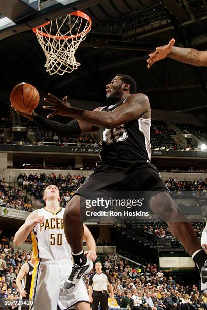 DeJuan Blair of the San Antonio Spurs shoots against the Indiana Pacers during the game on January 7, 2011 at Conseco Fieldhouse in Indianapolis,...