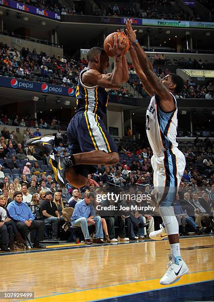 Mayo of the Memphis Grizzlies blocks a pass attempted by Ronnie Price of the Utah Jazz on January 7, 2011 at FedExForum in Memphis, Tennessee. NOTE...