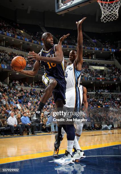 Francisco Elson of the Utah Jazz looks to pass against Hasheem Thabeet of the Memphis Grizzlies on January 7, 2011 at FedExForum in Memphis,...