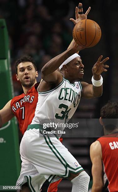 Paul Pierce of the Boston Celtics passes the ball as Andrea Bargnani of the Toronto Raptors defends on January 7, 2011 at the TD Garden in Boston,...