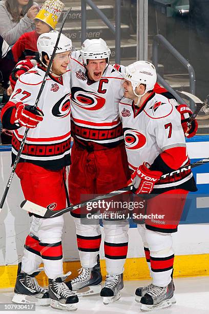Eric Staal of the Carolina Hurricanes celebrates a goal with teammates Brett Carson and Ian White against the Florida Panthers at the BankAtlantic...