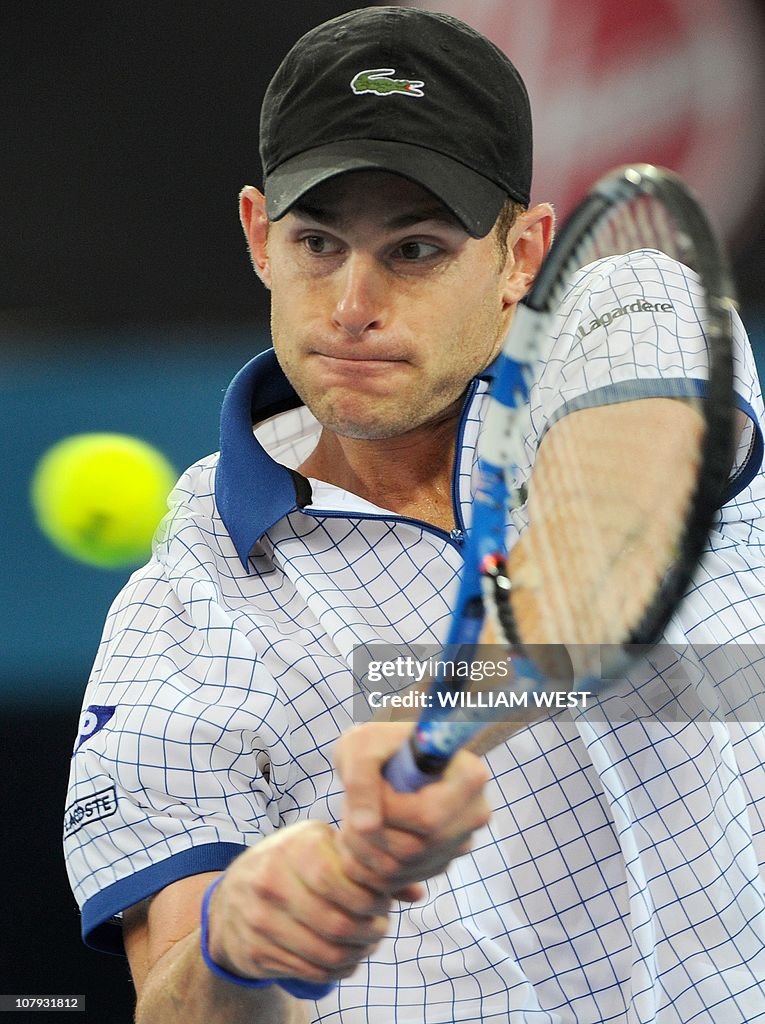 Andy Roddick of the US hits a backhand r
