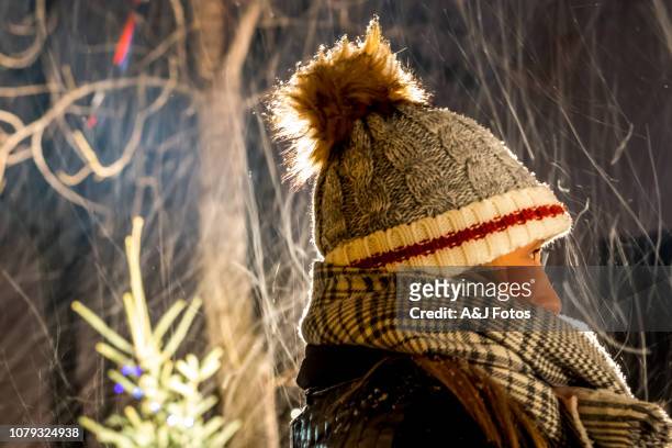 outdoor show in montreal's christmas market - tuques stock pictures, royalty-free photos & images