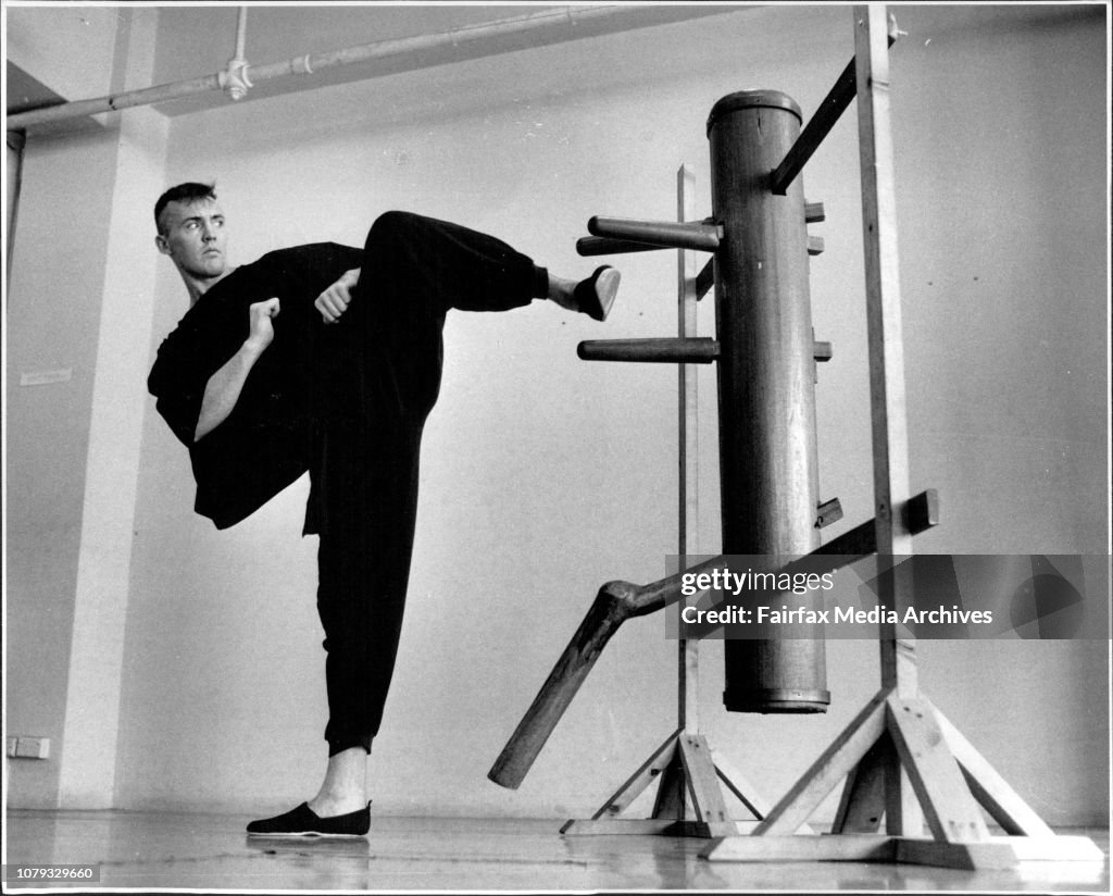 Full contact Kung Fu exponent training for fight against American champion.Rick Spain training using wooden dummy which is traditional.