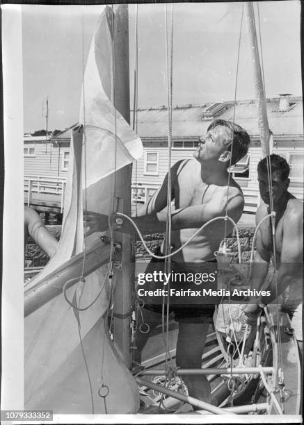 New Zealanders 18 footers on Sydney harbour for trials.Forward hand Noel Heerdegen slips the sail of Miss Tip Top into the mast while skipper Ken...