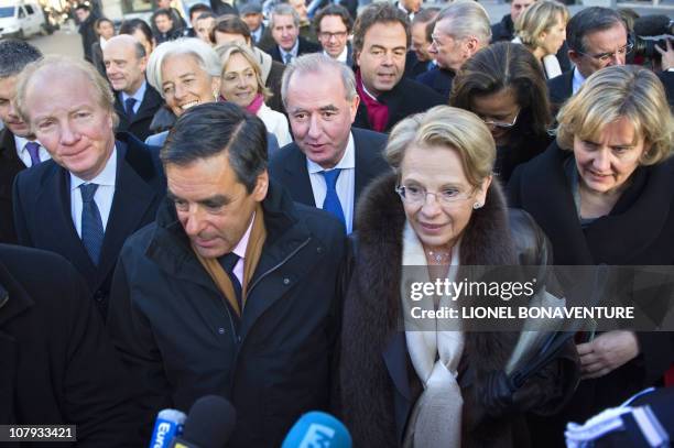 Members of the French government led by Prime Minister Francois Fillon and Foreign Affairs Minister Michele Alliot-Marie speak to the press as they...