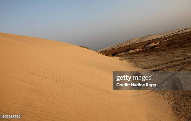 View of the Inland Sea area where a salt water bay for about 20 kilometers is sourrounded by desert on December 27, 2010 in Khor al Udaid, Qatar. The...