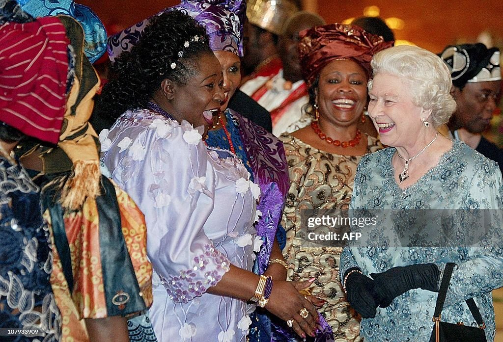Britain's Queen Elizabeth II (R) laughs