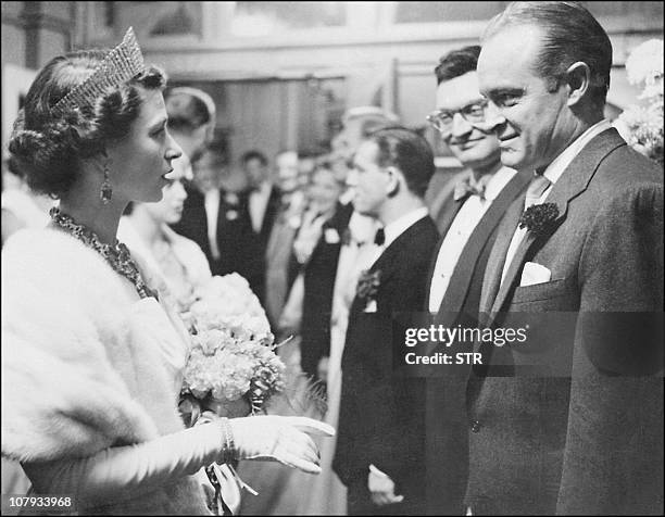 Entertainer Bob Hope is greeted by Queen Elizabeth II of England after he performed the "Royal Performance" with the Blue Bell Girls in London, in...