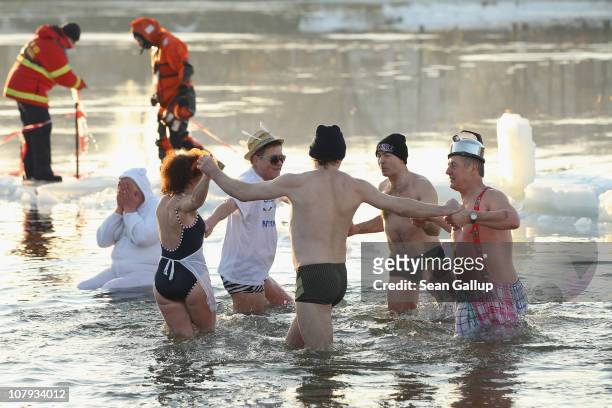 Ice swimming enthusiasts take to the frigid waters of Orankesee lake during the 27th annual "Winter Swimming in Berlin" on January 8, 2011 in Berlin,...