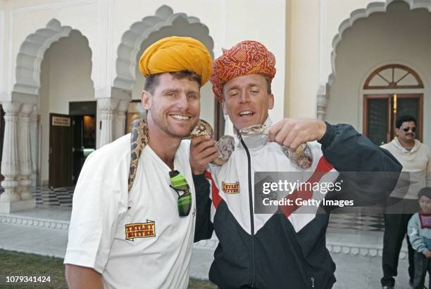 England players Robin Smith and Alec Stewart pictured posing with a snake during the 1993 England Cricket Tour to India.