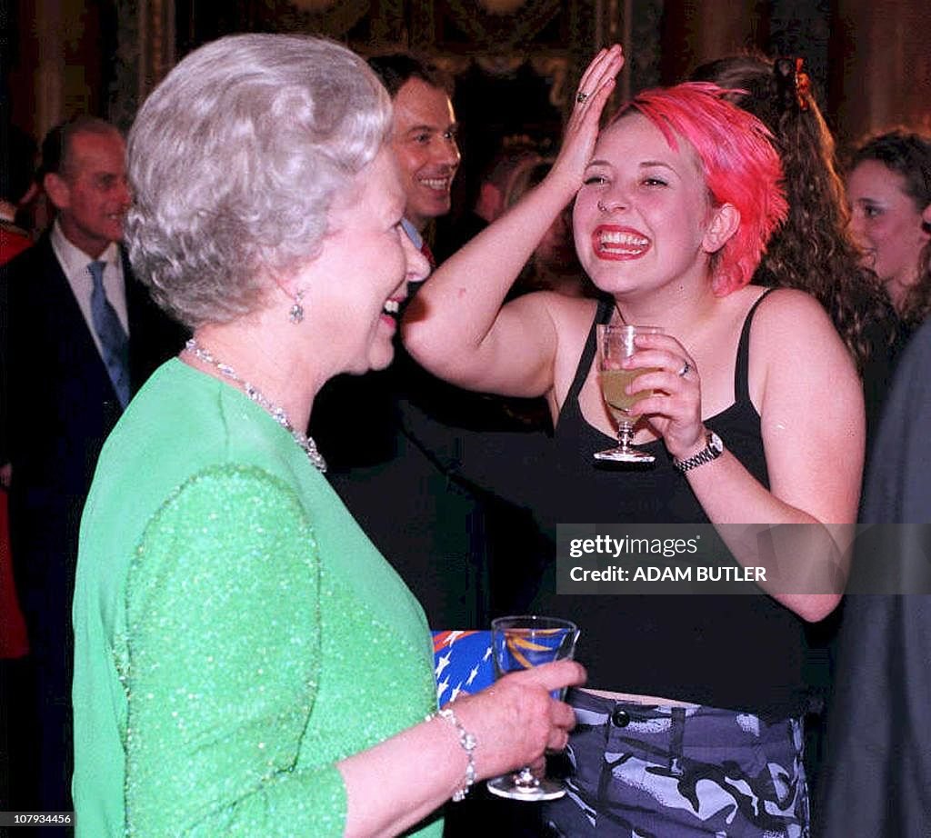 Britain's Queen Elizabeth II chats with