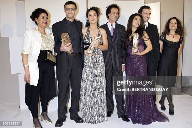 Franco-Tunisian director Abdellatif Kechiche poses with his Best director award and his awarded film team, such as Tunisian actress Hafsia Herzi ,...