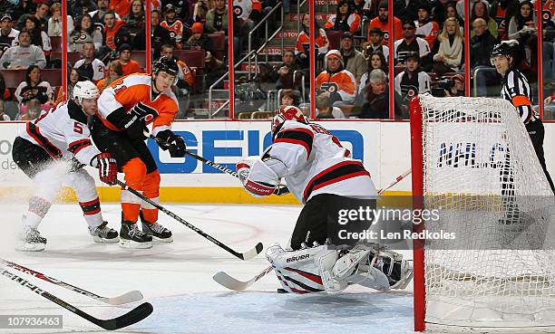 James van Riemsdyk of the Philadelphia Flyers scores on this shot past goaltender Johan Hedberg of the New Jersey Devils on January 8, 2011 at the...