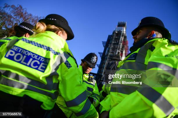 British police officers stand on patrol outside the Houses of Parliament in London, U.K., on Tuesday, Jan. 8, 2019. U.K. Prime Minister Theresa...