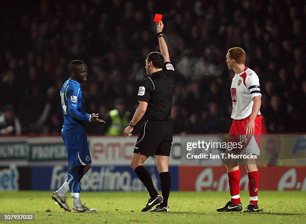 Cheick Tiote of Newcastle United is shown a red card by referee Andre Marriner during the FA Cup sponsored by e.on 3rd round match between Stevenage...