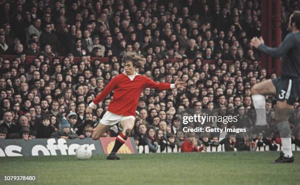 Manchester United player Sammy McIlroy prepares to cross the ball despite the attentions of Chelsea defender Ron Harris during a First Divison match...